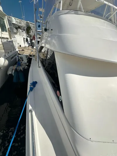  Yacht Photos Pics 2003 Riviera 40 Convertible yacht docked at a marina.