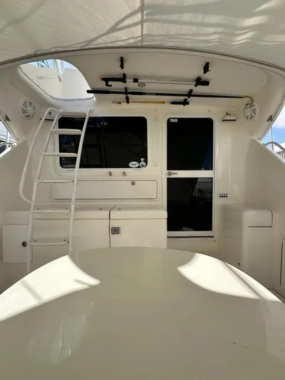  Yacht Photos Pics 2003 Riviera 40 Convertible yacht interior with ladder and storage compartments.