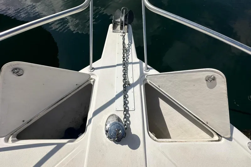  Yacht Photos Pics Bow of 2003 Riviera 40 Convertible yacht with anchor chain and storage compartments.