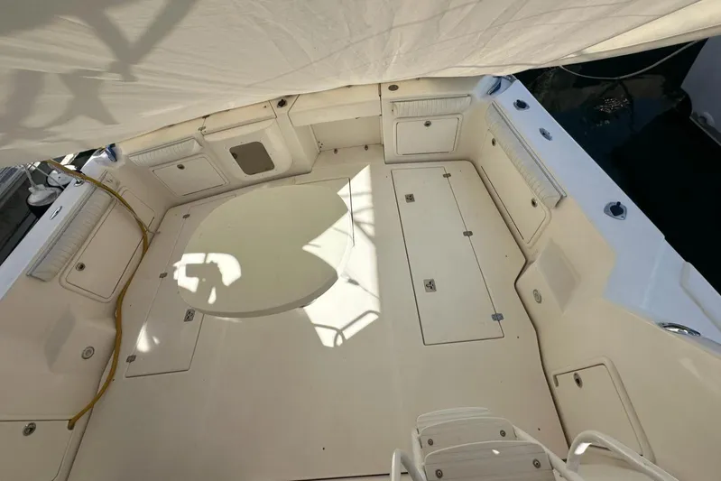  Yacht Photos Pics Spacious deck of a 2003 Riviera 40 Convertible yacht under a canopy.