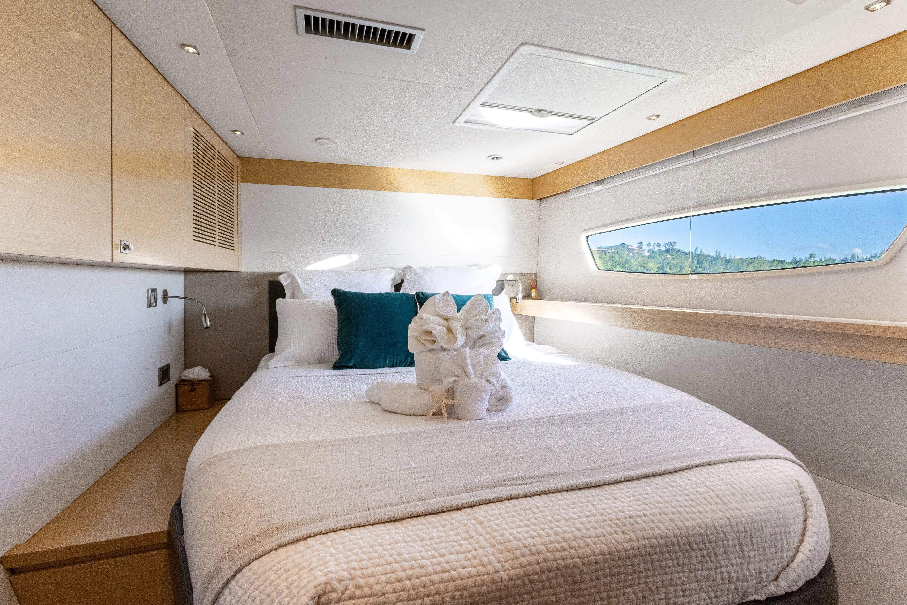  Yacht Photos Pics Luxurious cabin interior of 2017 Fountaine Pajot Victoria 67 yacht with elegant bedding.