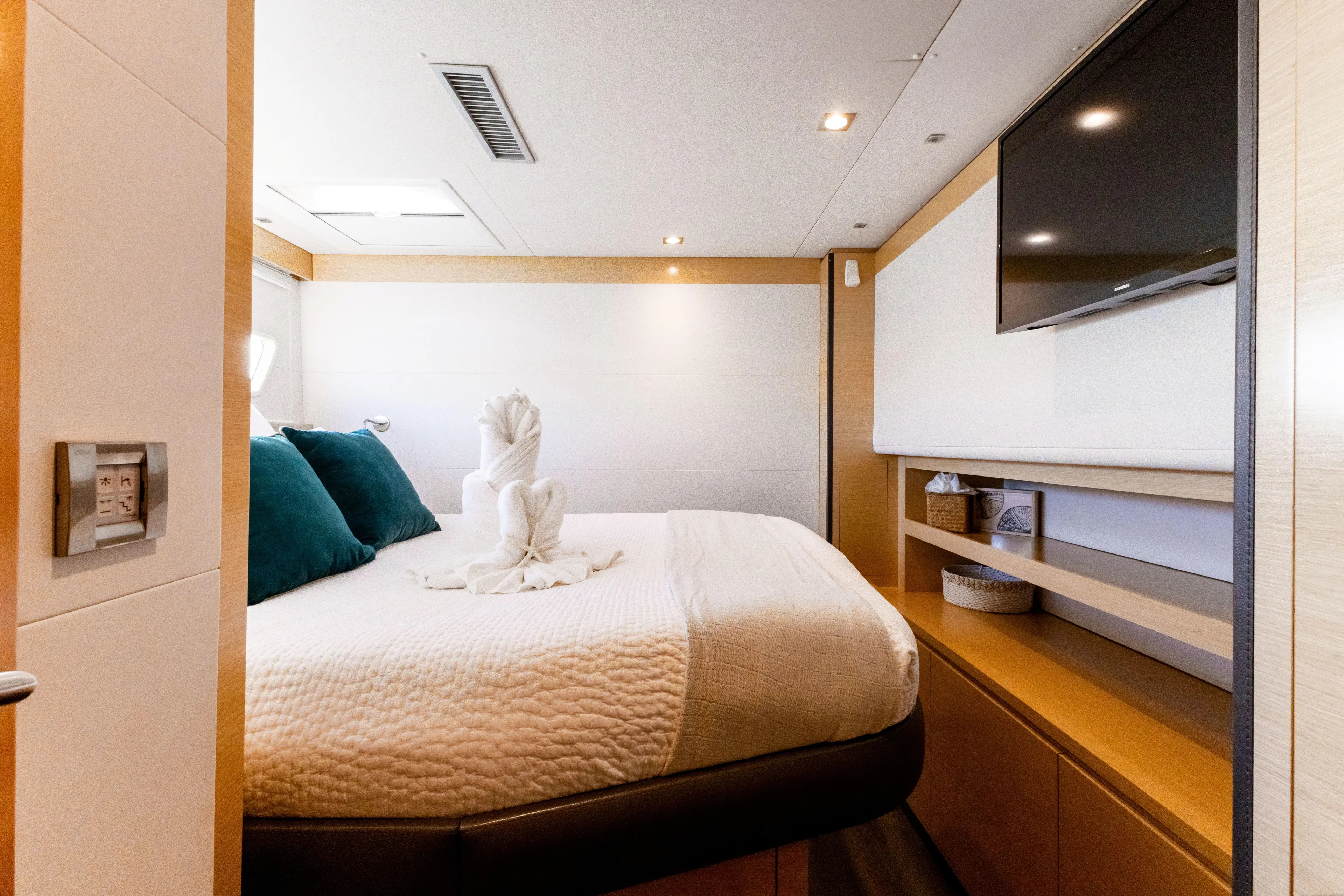  Yacht Photos Pics Luxurious bedroom interior of 2017 Fountaine Pajot Victoria 67 yacht with modern amenities.