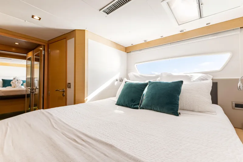  Yacht Photos Pics Luxurious bedroom interior of 2017 Fountaine Pajot Victoria 67 yacht with elegant bedding.