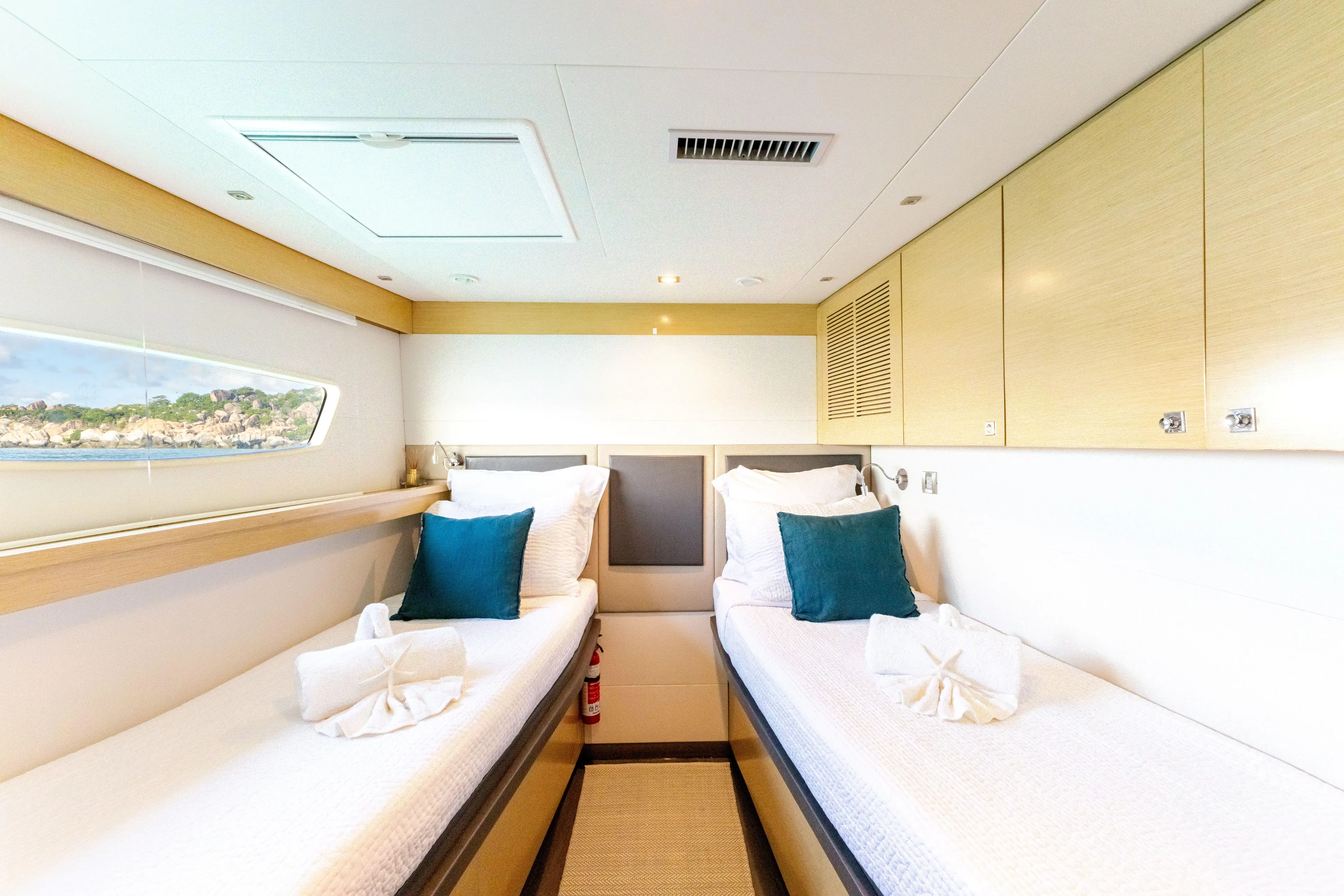  Yacht Photos Pics Luxurious twin cabin on 2017 Fountaine Pajot Victoria 67 yacht with elegant decor.