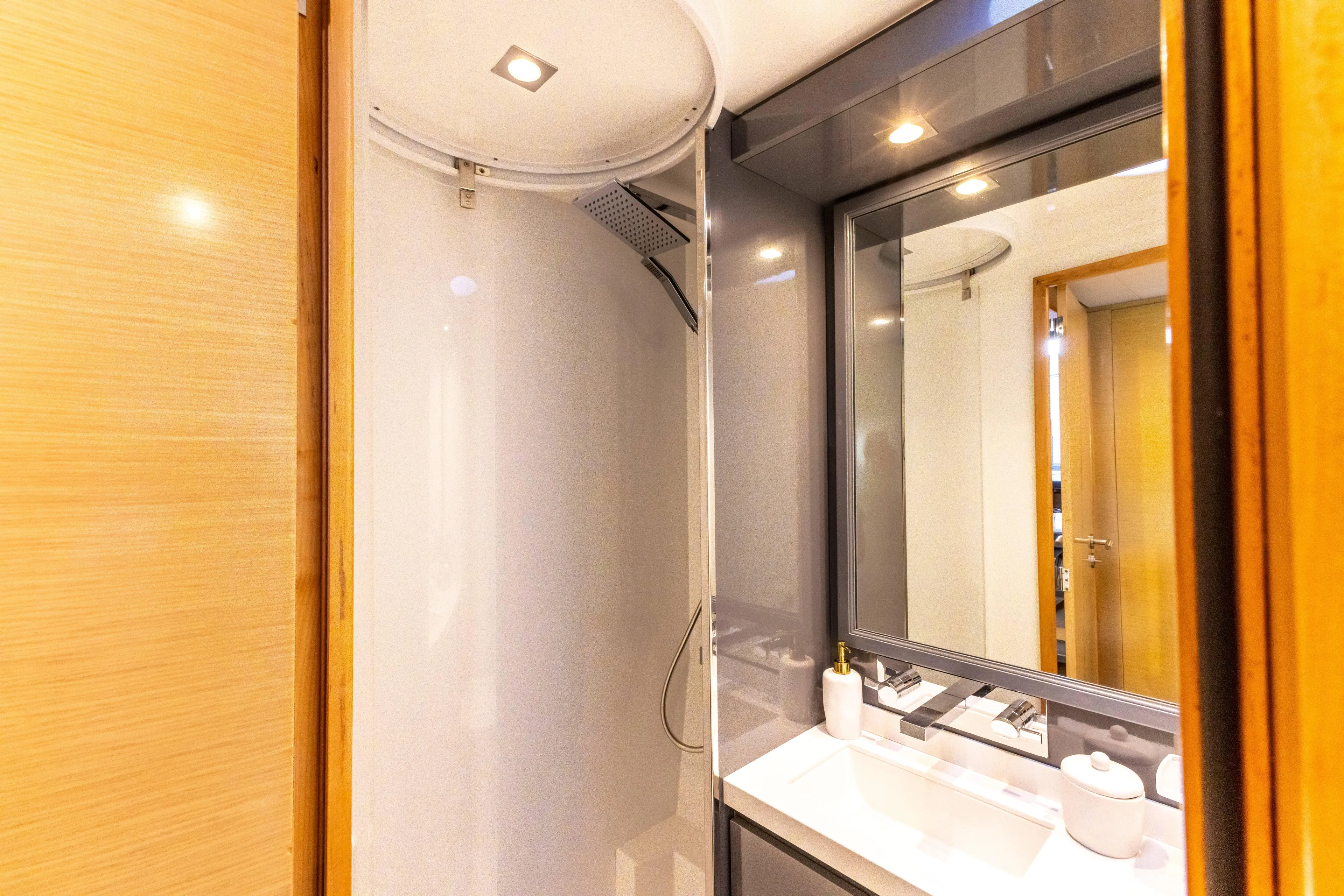  Yacht Photos Pics Luxurious bathroom in 2017 Fountaine Pajot Victoria 67 yacht, featuring modern shower and vanity.