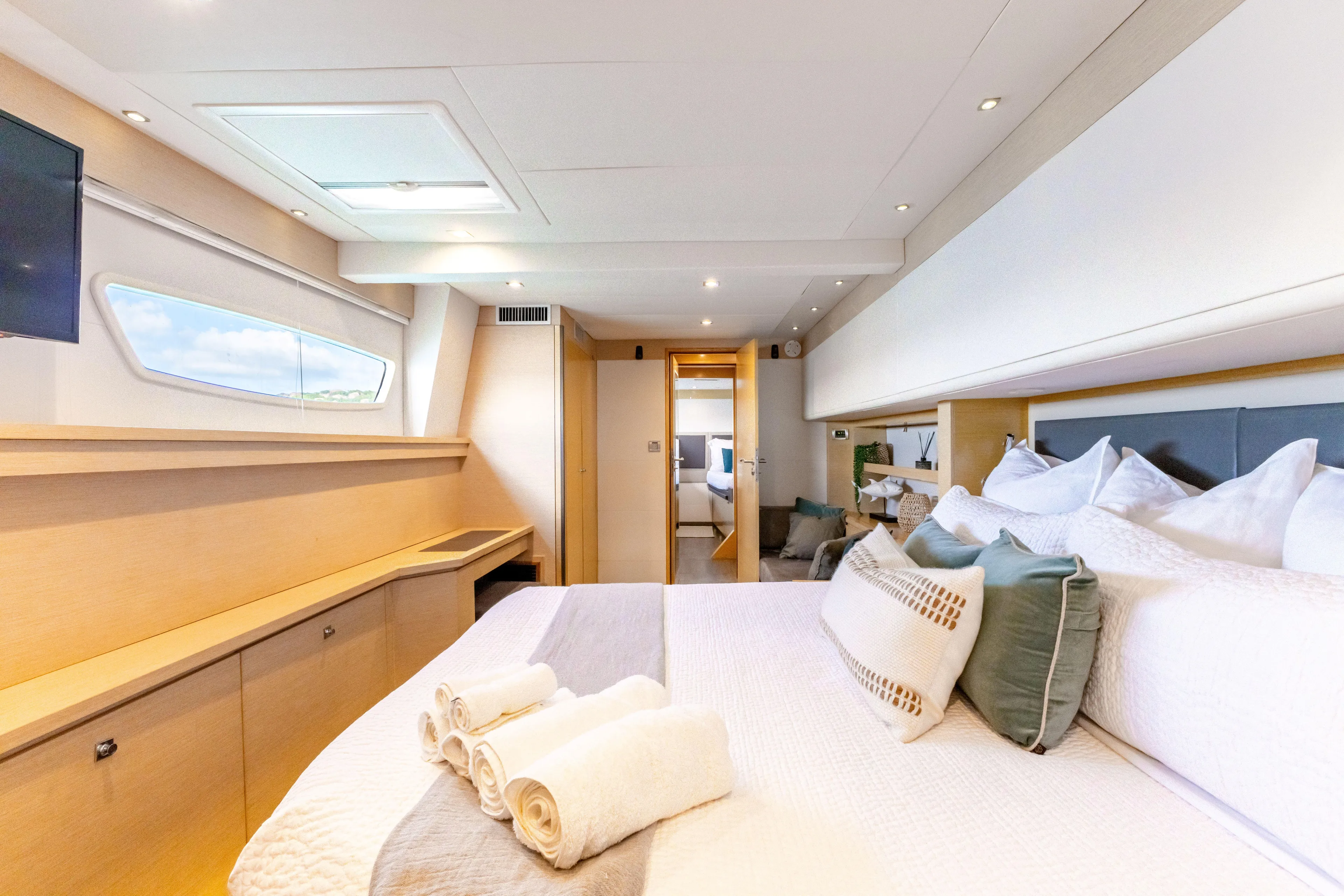  Yacht Photos Pics Luxurious cabin interior of 2017 Fountaine Pajot Victoria 67 yacht with elegant bedding.