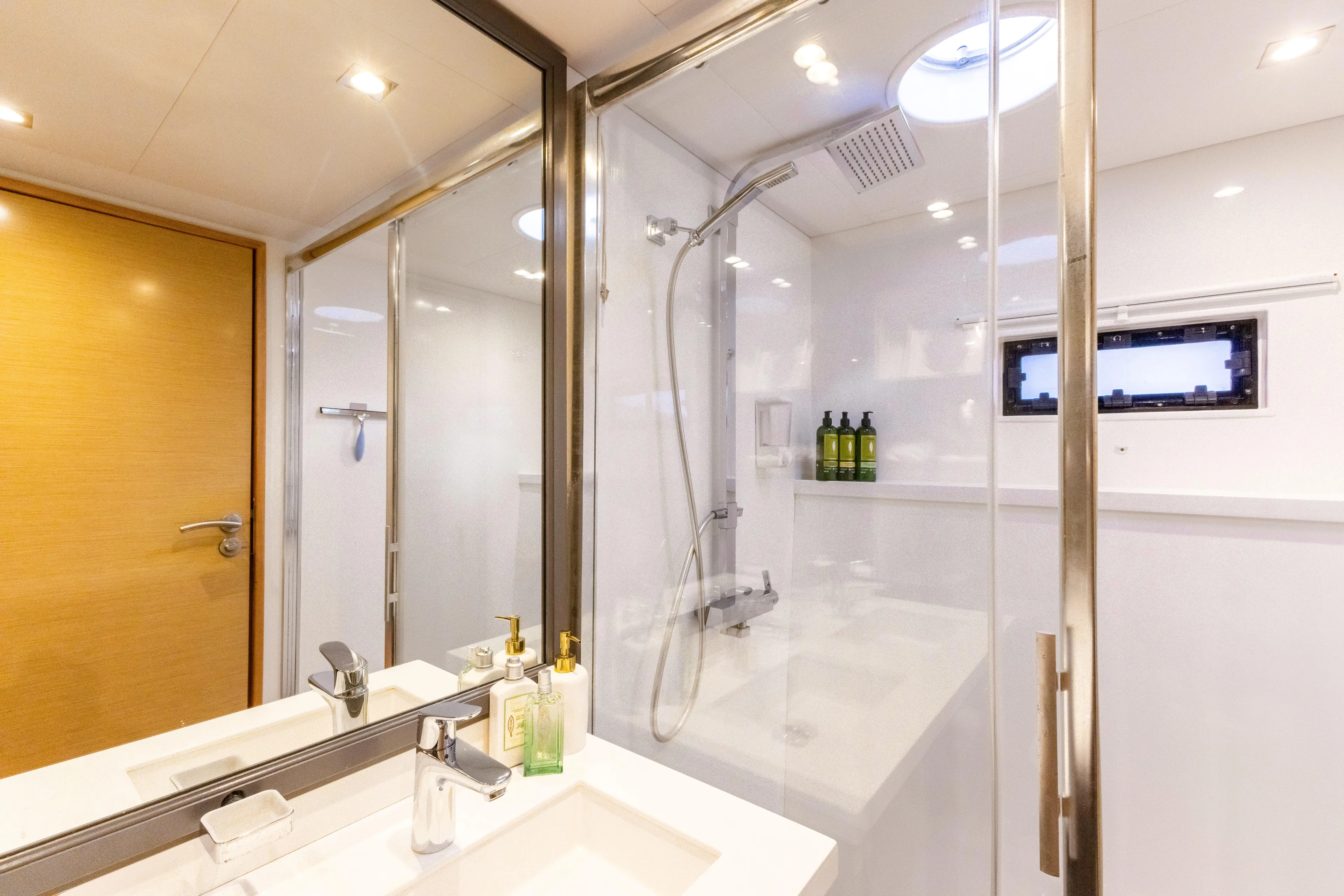  Yacht Photos Pics Luxurious bathroom in 2017 Fountaine Pajot Victoria 67 yacht with modern shower and sink.