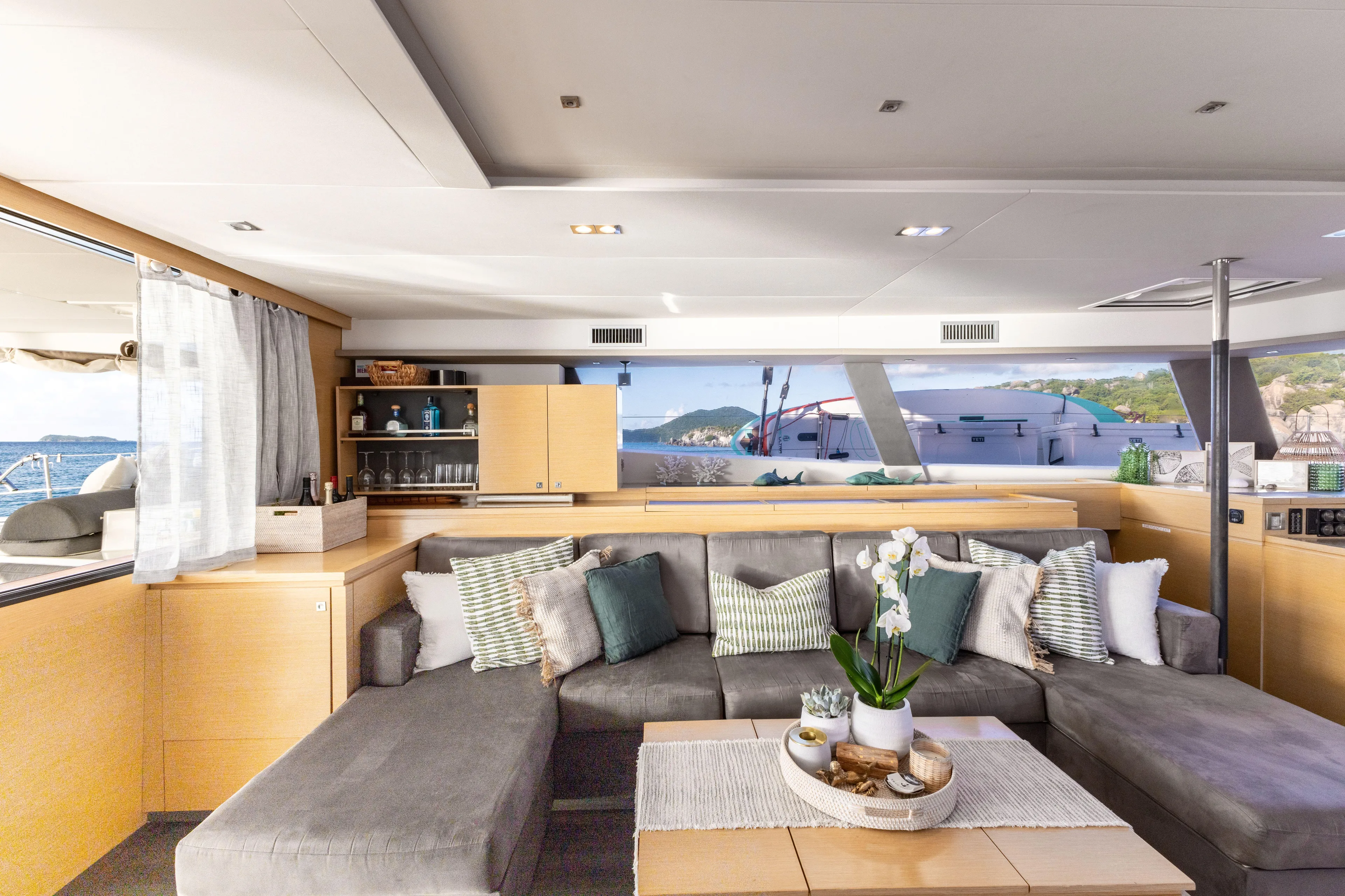  Yacht Photos Pics Luxurious interior of 2017 Fountaine Pajot Victoria 67 yacht with modern decor and comfortable seating.