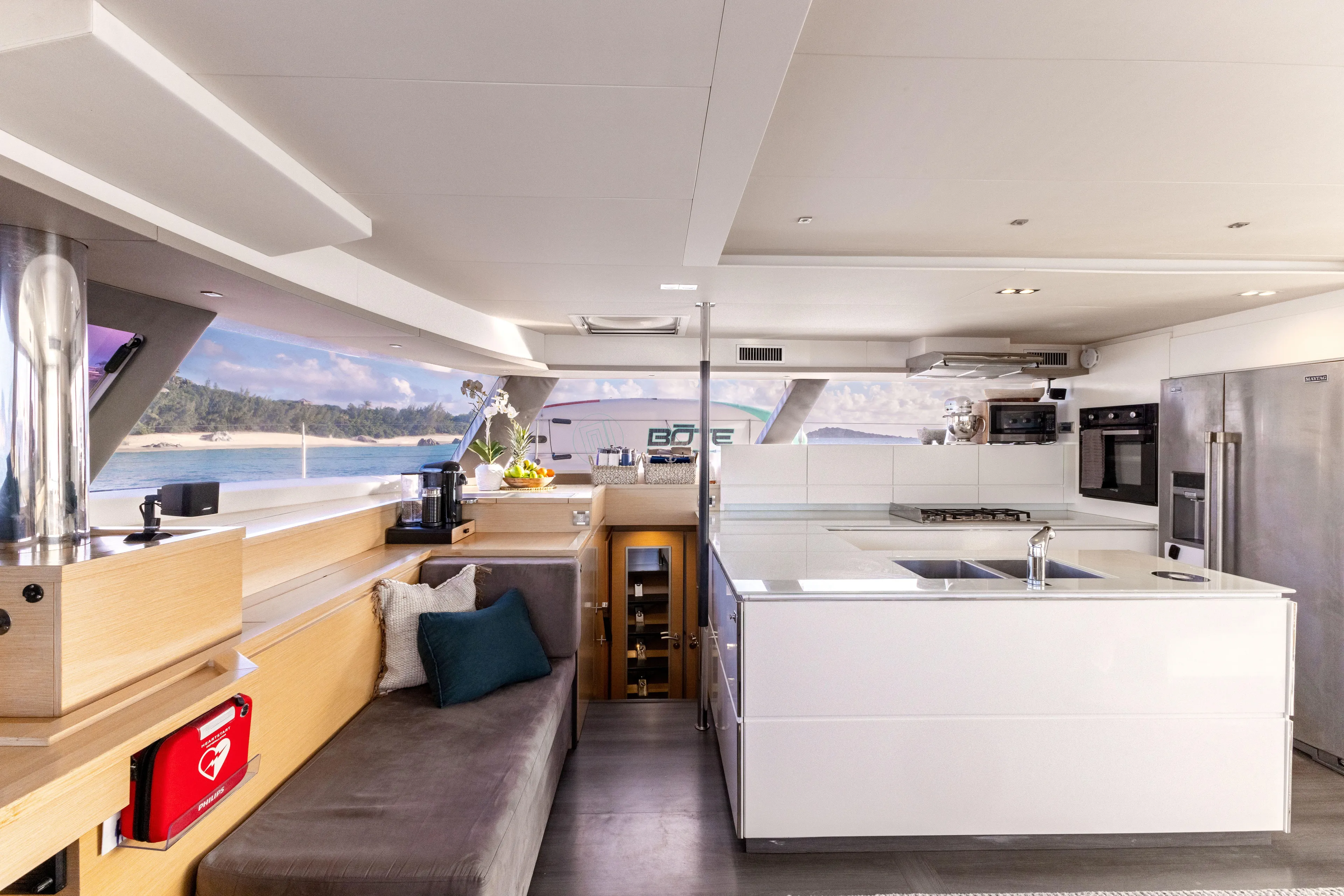  Yacht Photos Pics Luxurious interior of 2017 Fountaine Pajot Victoria 67 yacht with modern kitchen and seating area.