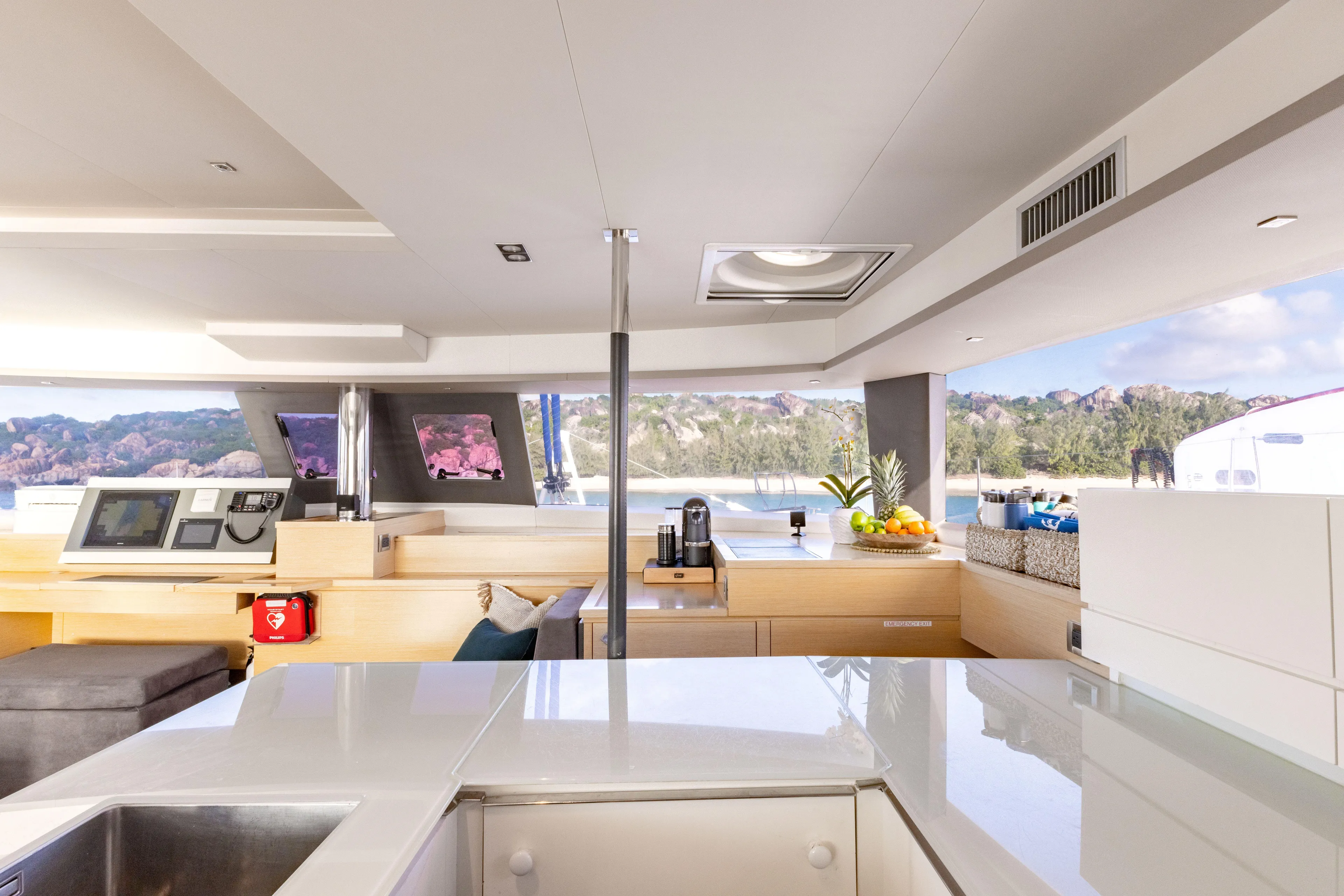  Yacht Photos Pics Luxurious interior of 2017 Fountaine Pajot Victoria 67 yacht with modern kitchen and scenic views.