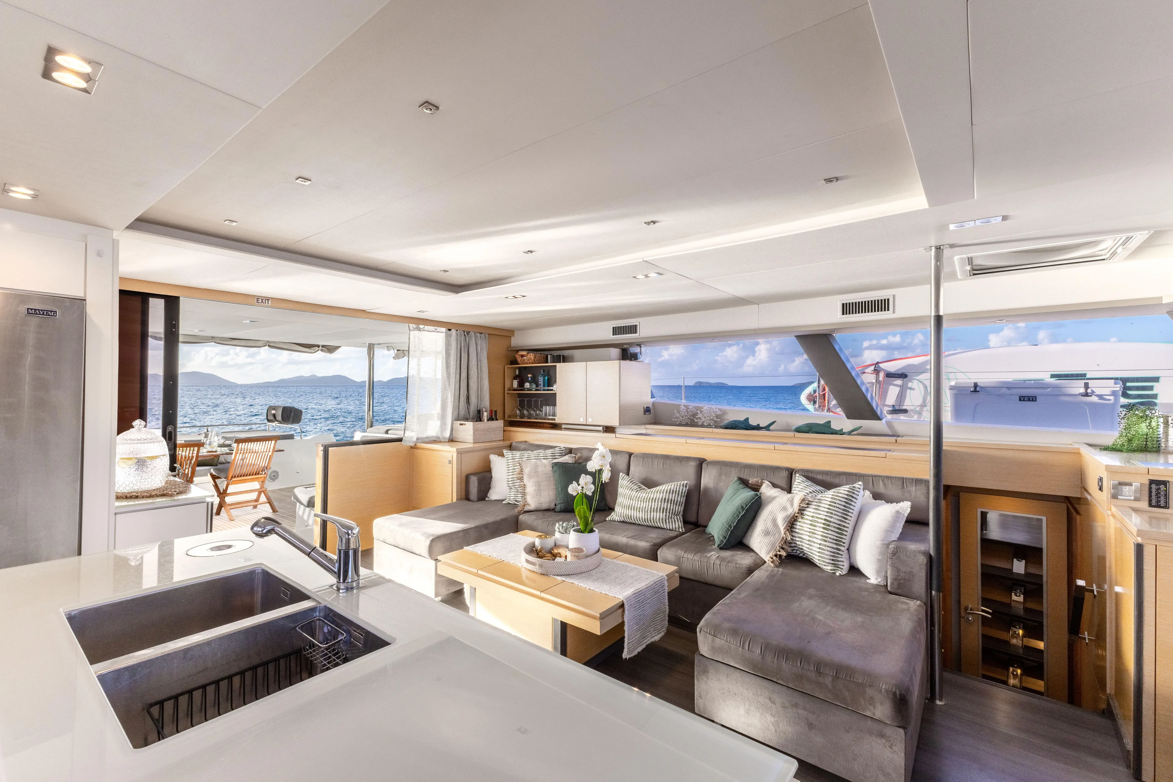  Yacht Photos Pics Luxurious interior of 2017 Fountaine Pajot Victoria 67 yacht with modern furnishings and ocean view.