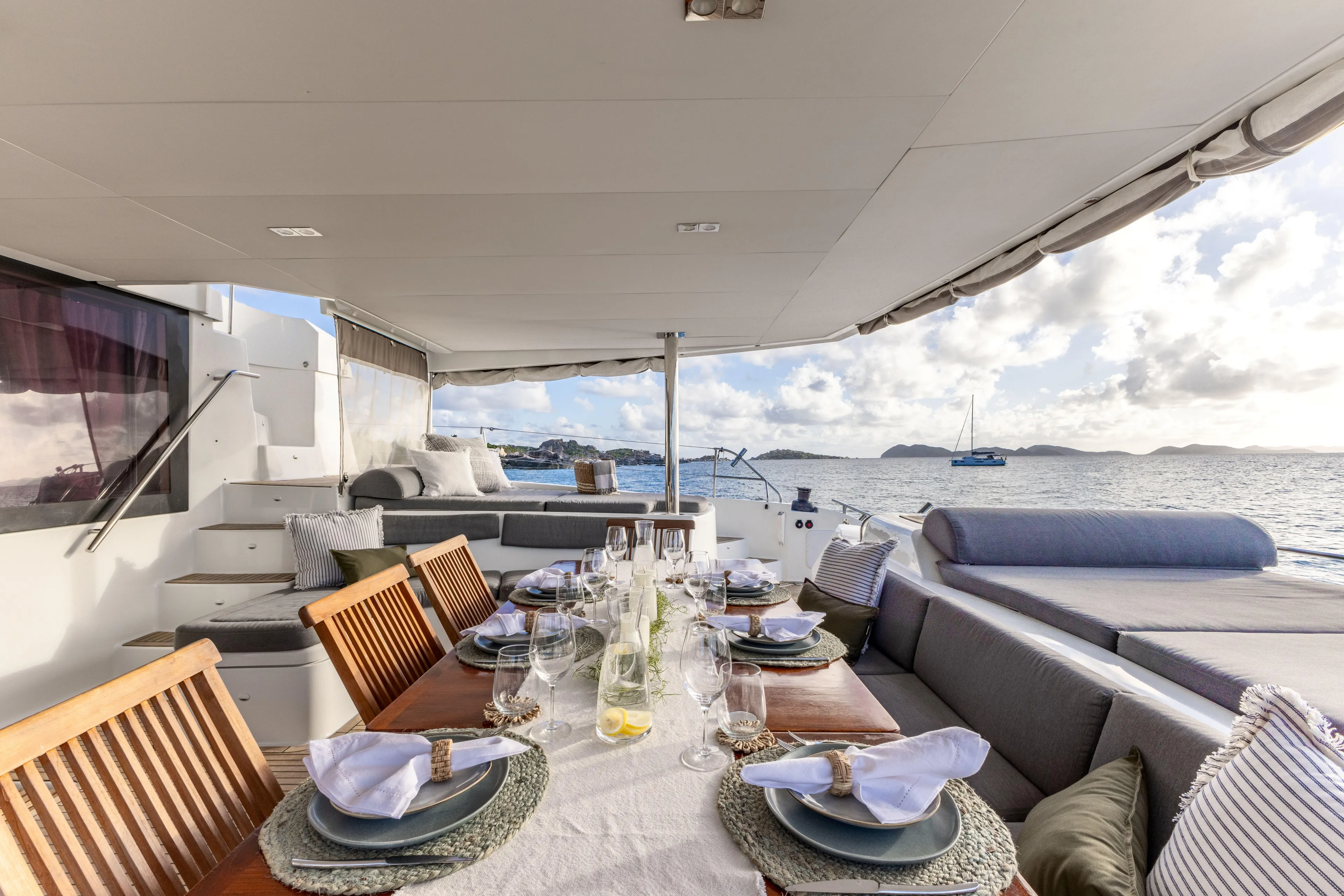  Yacht Photos Pics Luxurious dining area on a 2017 Fountaine Pajot Victoria 67 yacht with ocean view.
