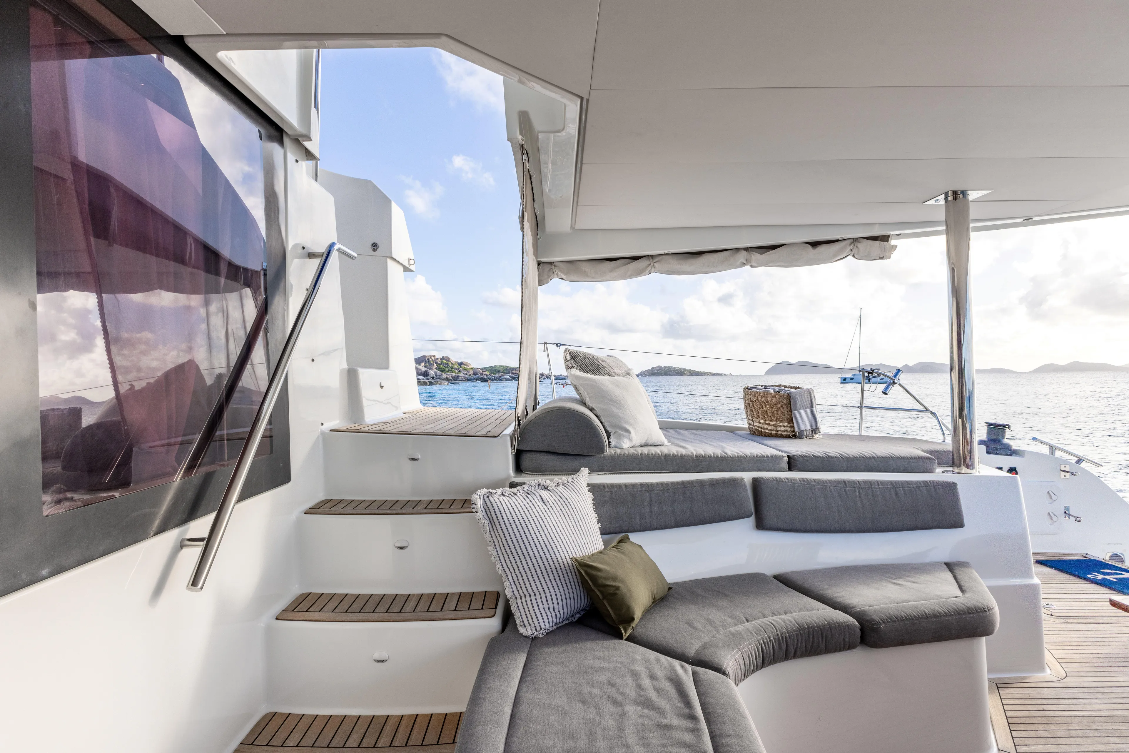  Yacht Photos Pics Luxurious 2017 Fountaine Pajot Victoria 67 yacht with elegant outdoor seating and ocean view.