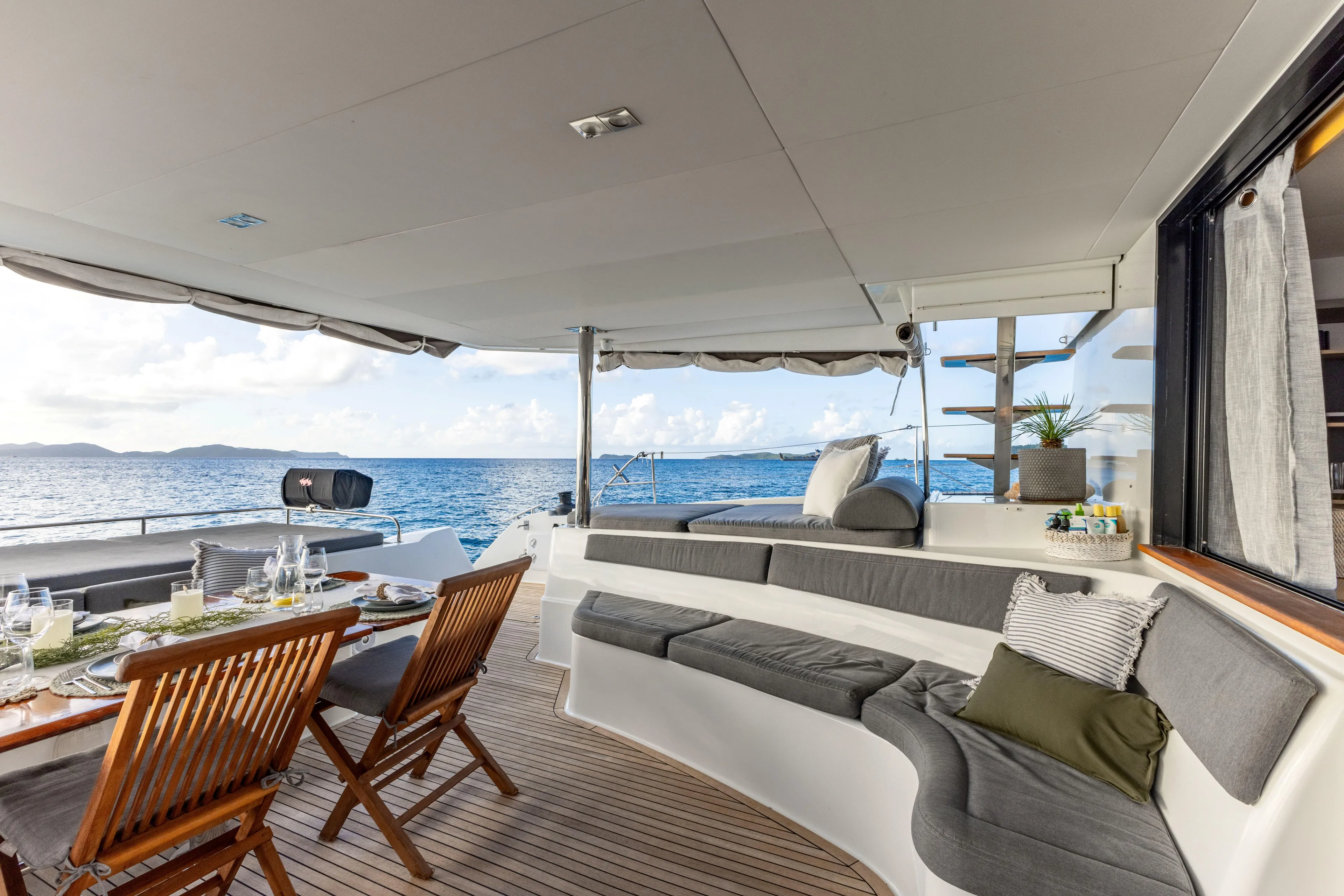  Yacht Photos Pics Luxurious 2017 Fountaine Pajot Victoria 67 yacht with elegant outdoor seating and dining area.