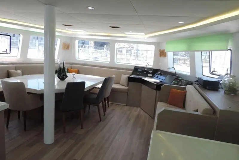  Yacht Photos Pics Luxurious interior of 2023 CK CK70 yacht with modern dining area and navigation station.