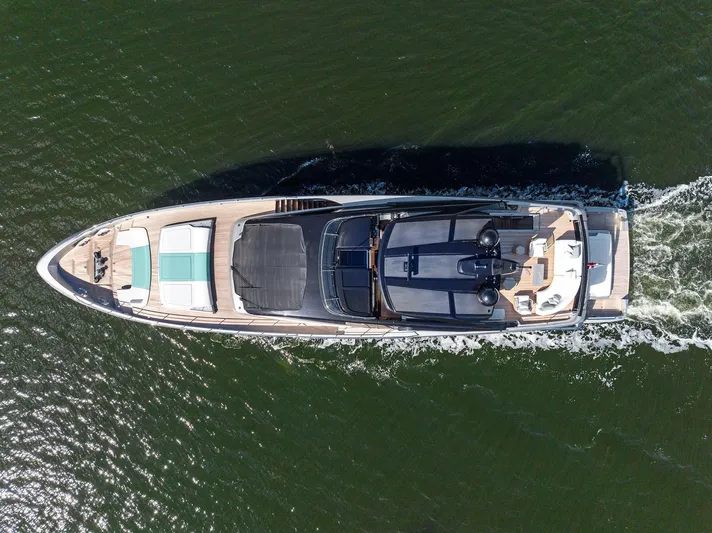 Beso Yacht Photos Pics Aerial view of 2024 Riva 102 Corsaro Super yacht cruising on water.