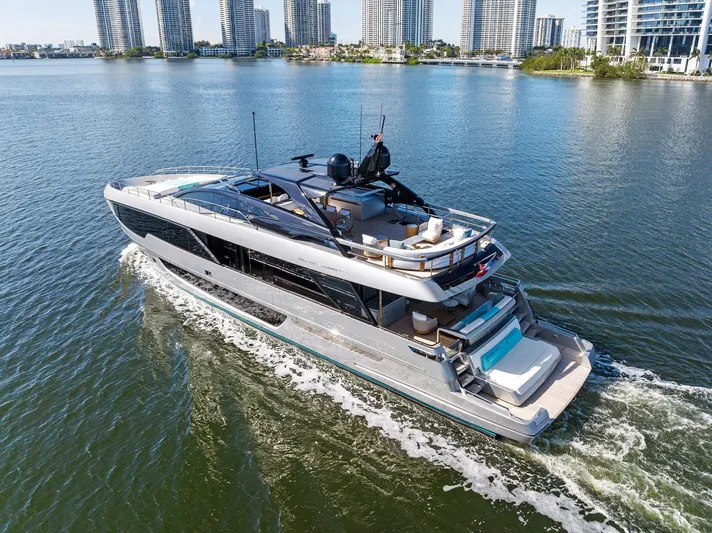 Beso Yacht Photos Pics Luxurious 2024 Riva 102 Corsaro Super yacht cruising in a scenic waterfront setting.