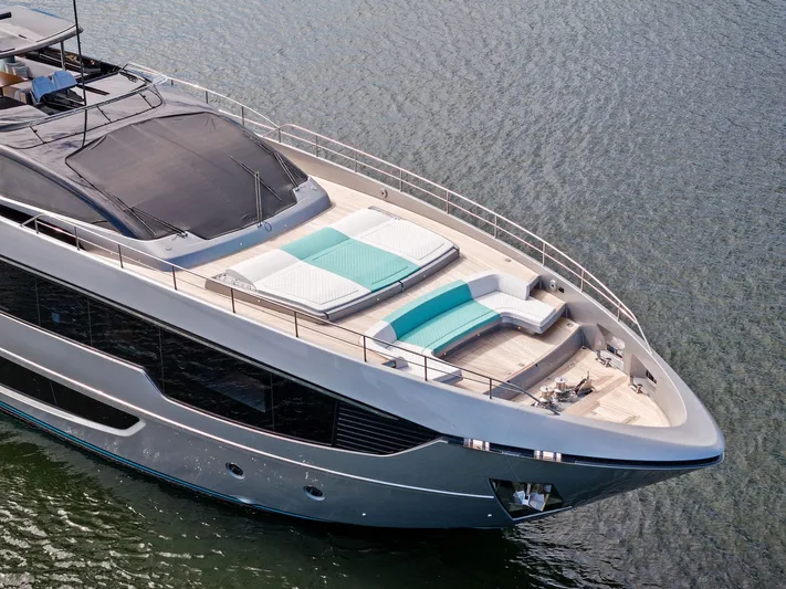 Beso Yacht Photos Pics Luxurious 2024 Riva 102 Corsaro Super yacht with elegant deck design on water.