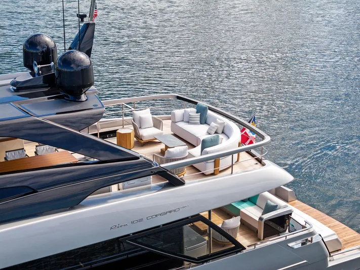Beso Yacht Photos Pics Luxurious 2024 Riva 102 Corsaro Super yacht with elegant deck seating on water.