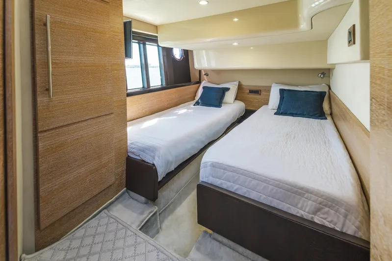Prime Time Yacht Photos Pics Luxurious twin bedroom in 2012 Azimut 48 Flybridge yacht with modern wood finishes.