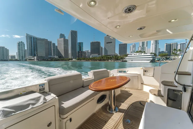 Prime Time Yacht Photos Pics Azimut 48 Flybridge 2012 yacht cruising with city skyline view in the background.