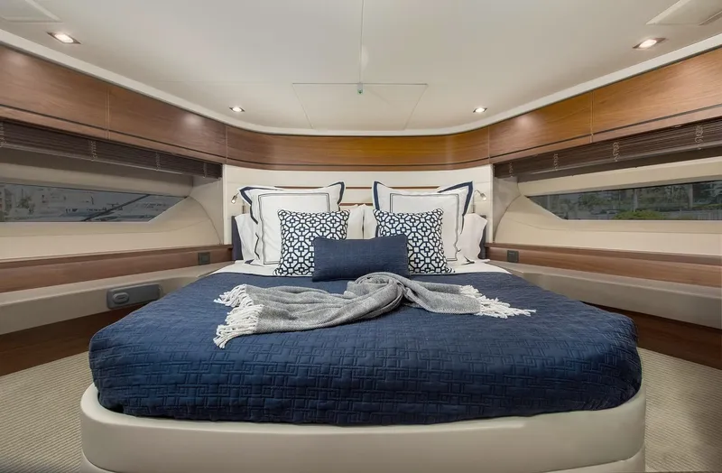 Clarity Yacht Photos Pics Luxurious bedroom interior of 2015 Princess Flybridge 68 Motor Yacht with elegant bedding.