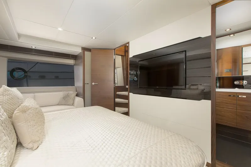 Clarity Yacht Photos Pics Luxurious bedroom interior of 2015 Princess Flybridge 68 Motor Yacht with modern decor.