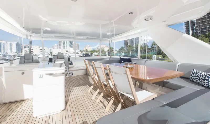 Clarity Yacht Photos Pics Luxurious 2015 Princess Flybridge 68 Motor Yacht with elegant outdoor seating and dining area.