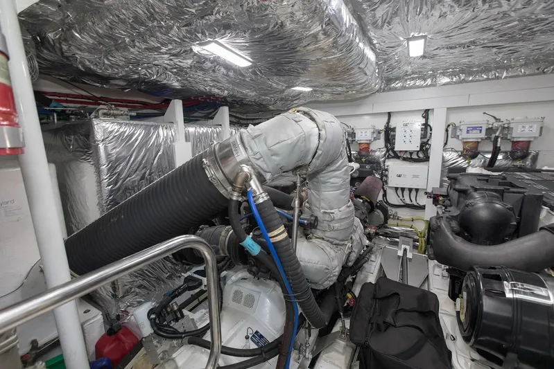 Clarity Yacht Photos Pics Engine room of 2015 Princess Flybridge 68 Motor Yacht with insulated pipes and machinery.