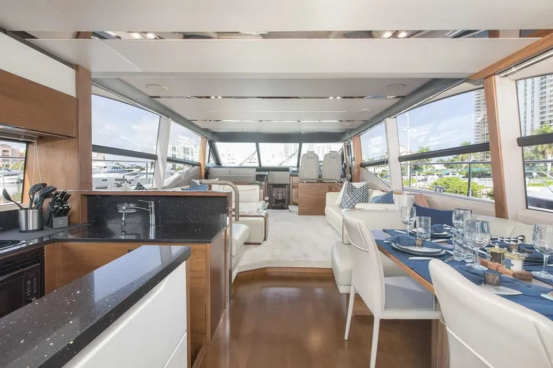 Clarity Yacht Photos Pics Luxurious interior of 2015 Princess Flybridge 68 Motor Yacht with elegant dining and seating areas.