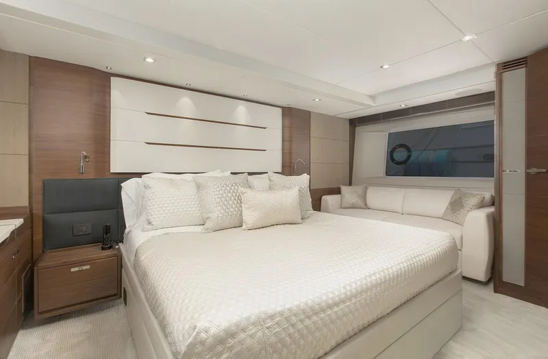 Clarity Yacht Photos Pics Luxurious bedroom interior of 2015 Princess Flybridge 68 Motor Yacht with elegant decor.