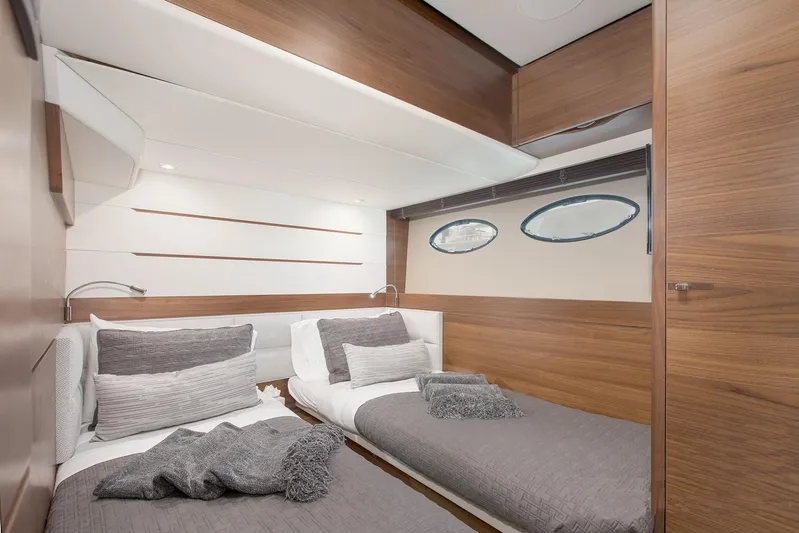 Clarity Yacht Photos Pics Luxurious cabin interior of 2015 Princess Flybridge 68 Motor Yacht with twin beds.
