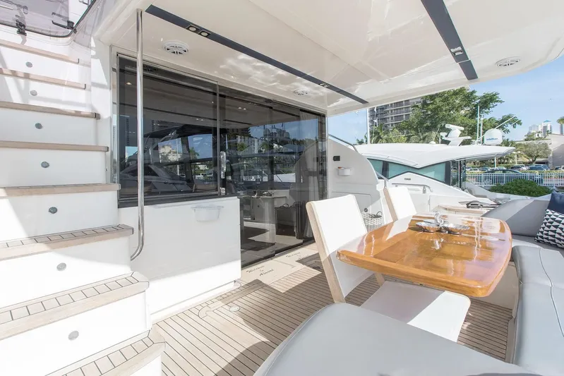 Clarity Yacht Photos Pics Luxurious 2015 Princess Flybridge 68 Motor Yacht with elegant outdoor dining area.
