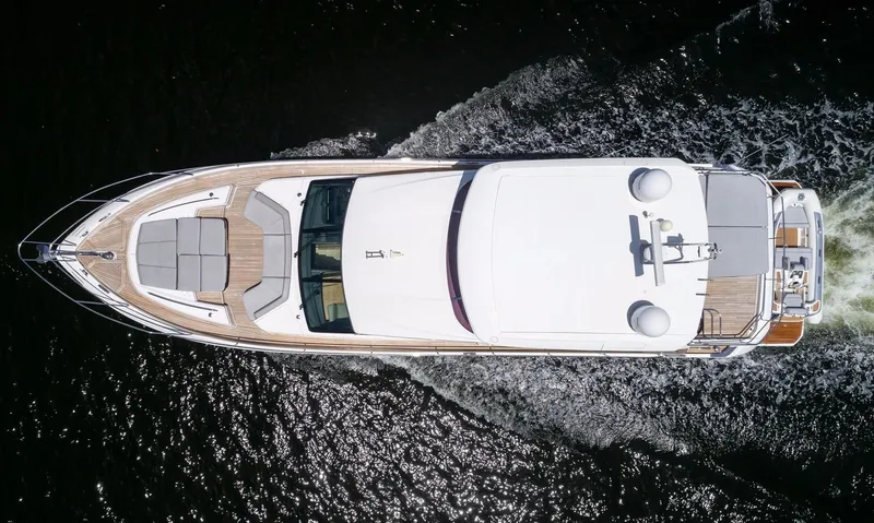 Clarity Yacht Photos Pics Overhead view of 2015 Princess Flybridge 68 Motor Yacht cruising on water.
