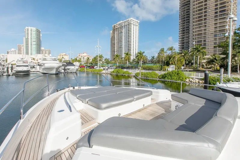 Clarity Yacht Photos Pics Luxurious 2015 Princess Flybridge 68 Motor Yacht docked in a scenic marina.