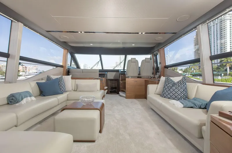 Clarity Yacht Photos Pics Luxurious interior of 2015 Princess Flybridge 68 Motor Yacht with elegant seating and panoramic windows.