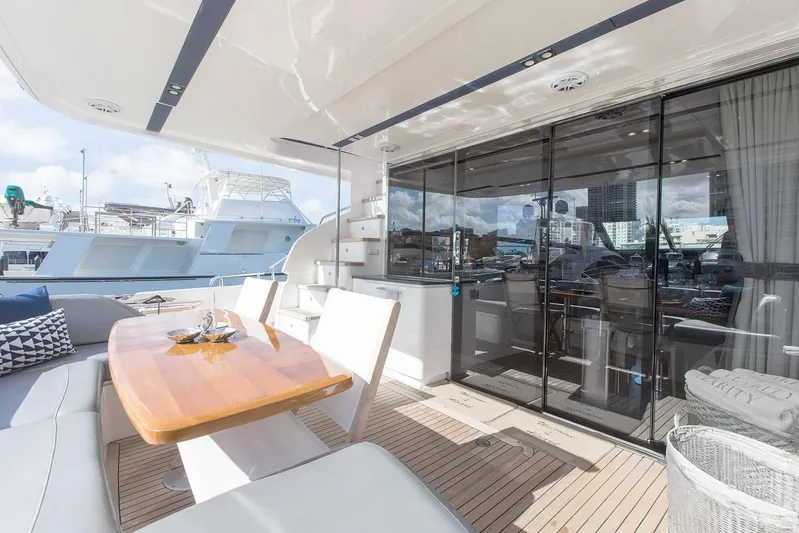 Clarity Yacht Photos Pics Luxurious 2015 Princess Flybridge 68 Motor Yacht with elegant outdoor seating and dining area.