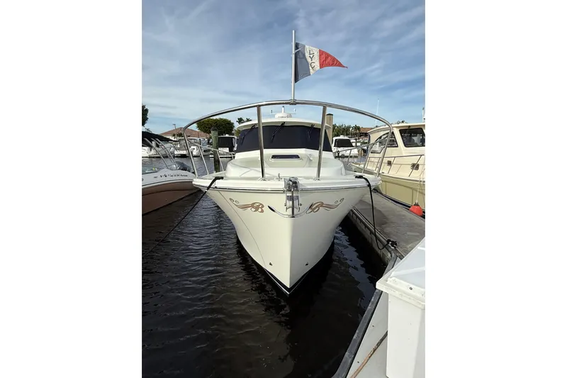 Jubilee Yacht Photos Pics 2018 Back Cove 32 boat docked at marina, front view with flag.