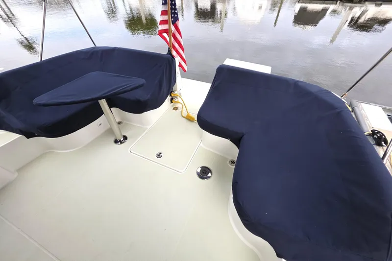 Jubilee Yacht Photos Pics 2018 Back Cove 32 boat deck with navy seating and American flag.