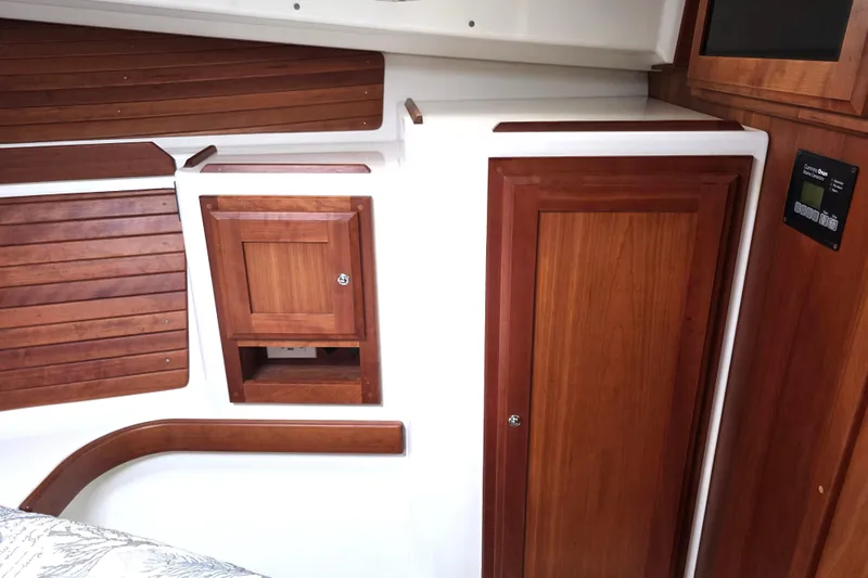 Jubilee Yacht Photos Pics 2018 Back Cove 32 interior with wooden cabinetry and paneling.