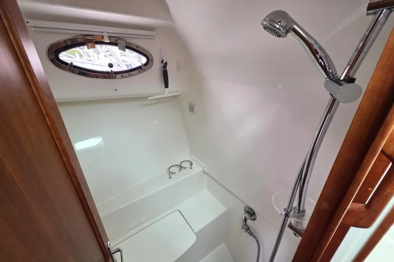 Jubilee Yacht Photos Pics 2018 Back Cove 32 yacht bathroom with shower and porthole window.