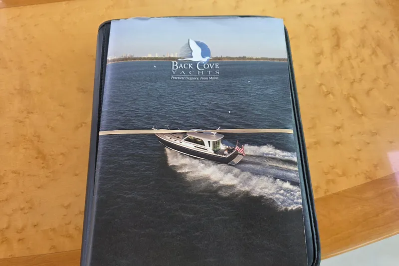 Jubilee Yacht Photos Pics Cover of a Back Cove Yachts brochure featuring a 2018 Back Cove 32 model on the water.