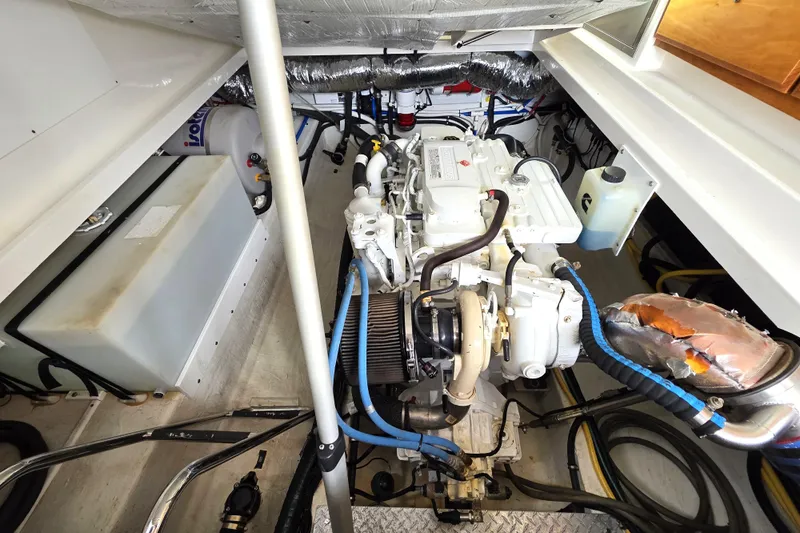 Jubilee Yacht Photos Pics Engine compartment of a 2018 Back Cove 32 boat, showcasing mechanical components and wiring.