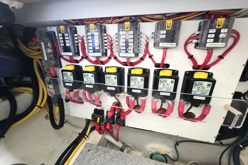 Jubilee Yacht Photos Pics Electrical panel of a 2018 Back Cove 32 boat with labeled wiring and switches.