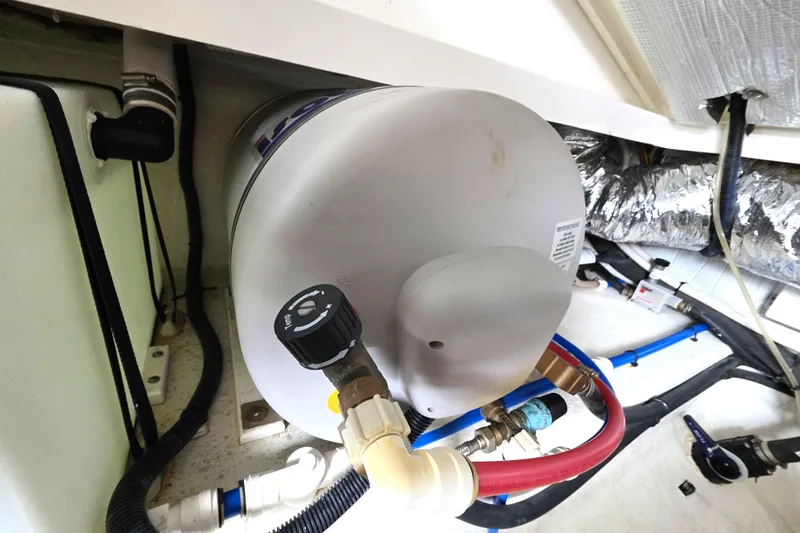 Jubilee Yacht Photos Pics 2018 Back Cove 32 boat engine compartment with water heater and plumbing.