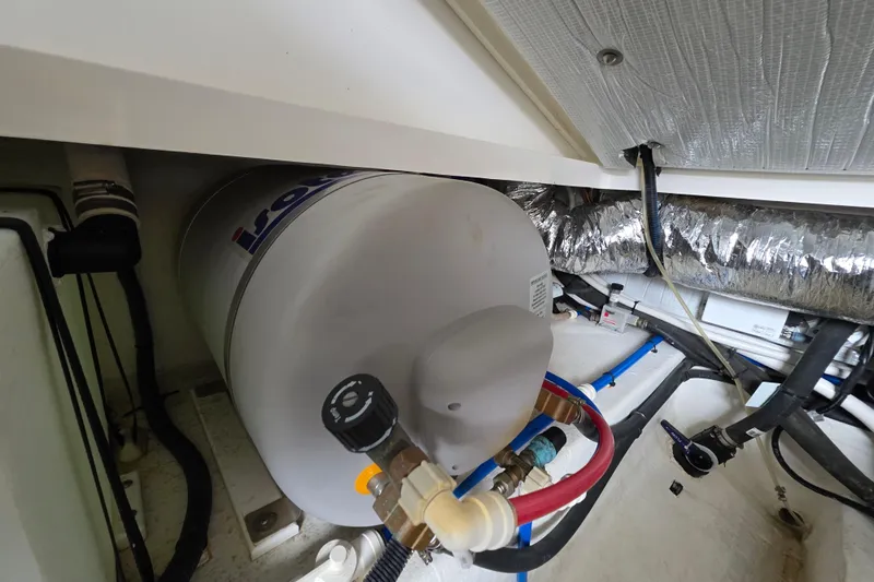 Jubilee Yacht Photos Pics 2018 Back Cove 32 boat engine room with Isotemp water heater and insulated ductwork.