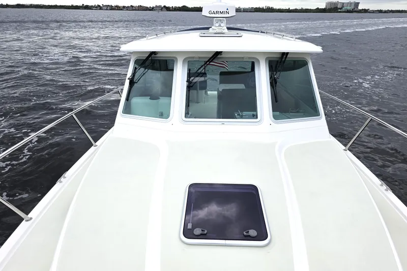 Jubilee Yacht Photos Pics 2018 Back Cove 32 boat on water, featuring Garmin equipment and sleek design.