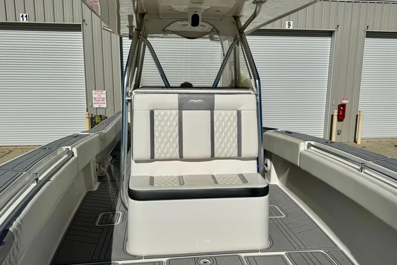  Yacht Photos Pics 2014 Invincible 36 Open Fisherman boat interior with cushioned seating and storage compartments.