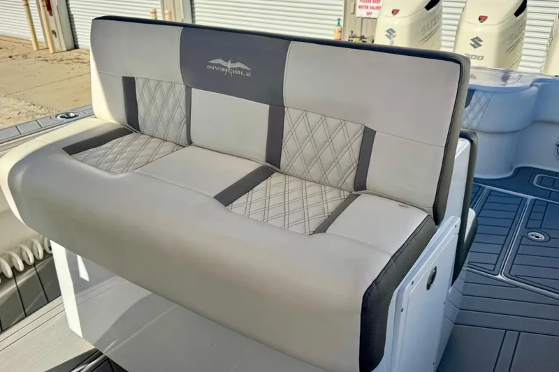  Yacht Photos Pics 2014 Invincible 36 Open Fisherman boat seat with diamond-pattern upholstery.