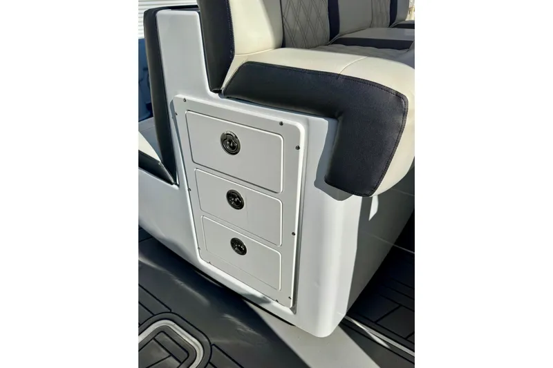  Yacht Photos Pics 2014 Invincible 36 Open Fisherman boat interior with storage drawers and cushioned seating.